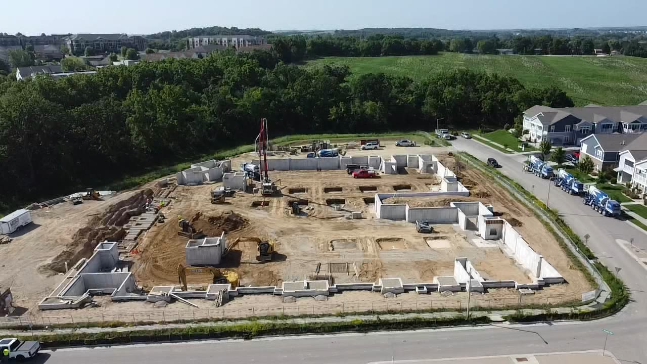 Aerial view of a commercial apartment complex foundation and site work